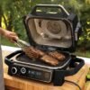 719AigD0TGL._AC_SL1400_ Ninja OG705CO Outdoor Electric Grill and Smoker Review versatile 7-in-1 Cooking Gamechanger